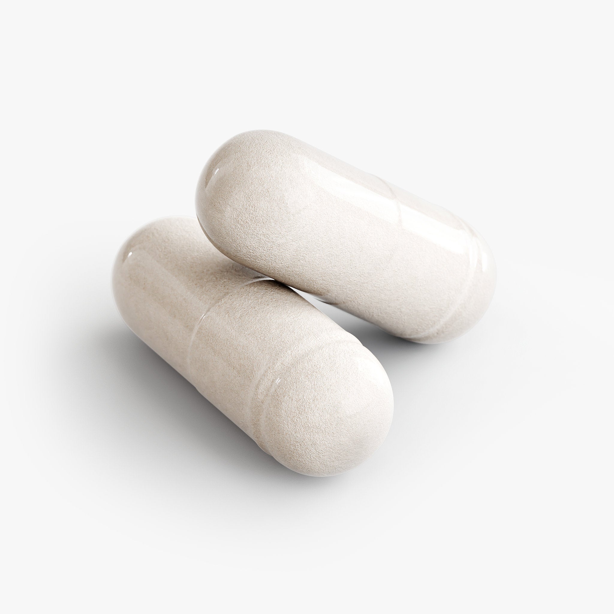Two beige 5-HTP capsules on a white background