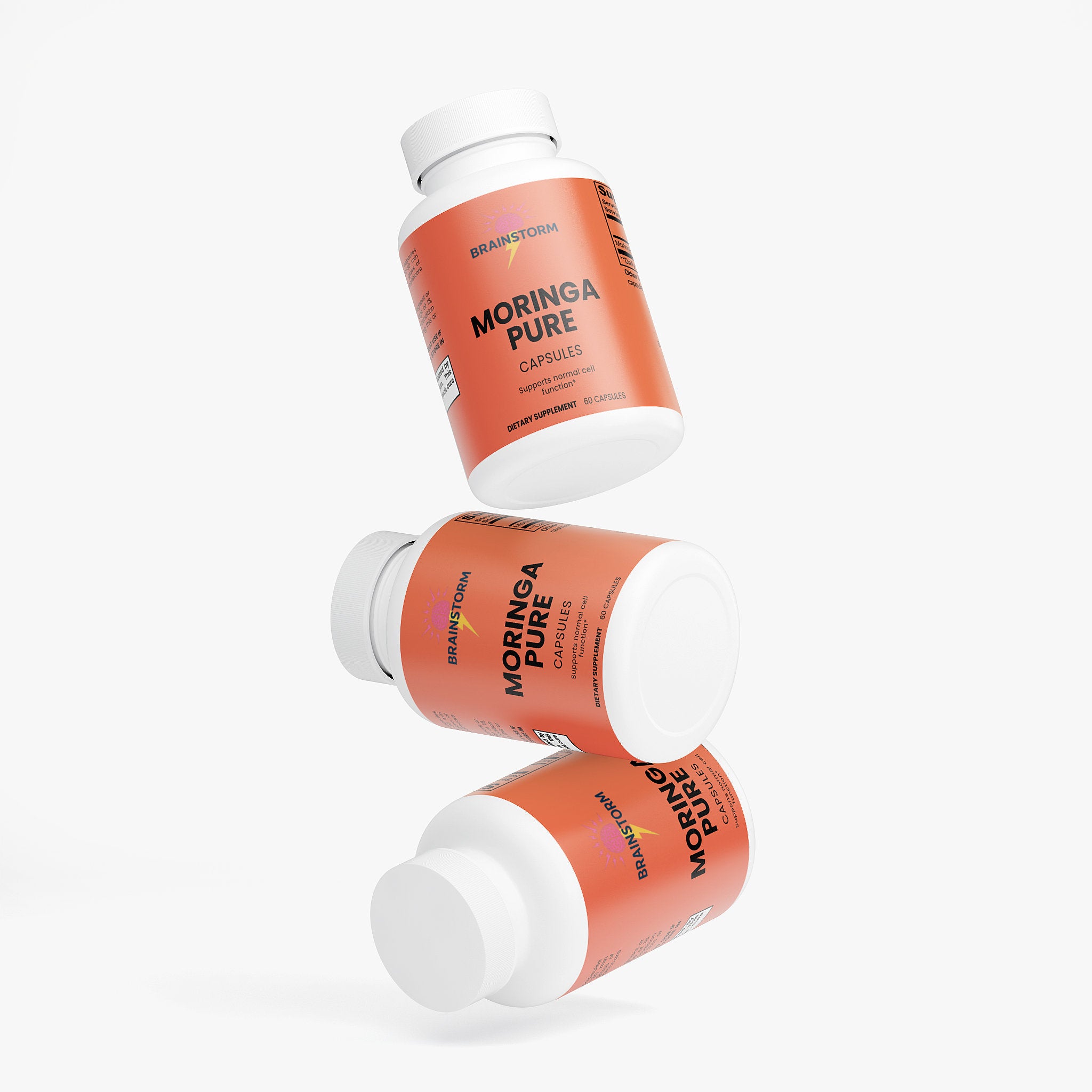 Three bottles of Moringa Pure capsules on a white background
