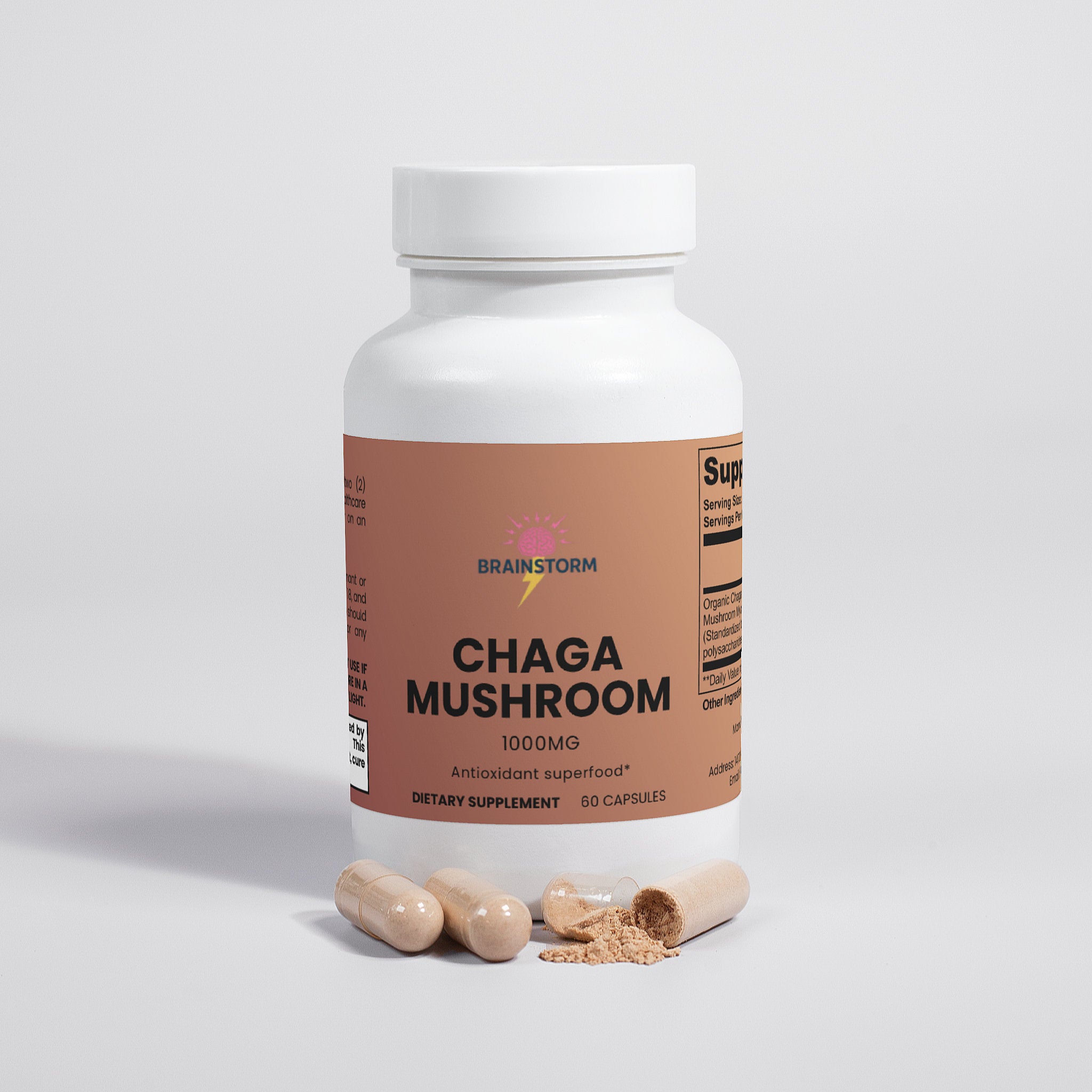 Supplement bottle labeled 'Chaga Mushroom' by Brainstorm with capsules in front of container on a light gray background